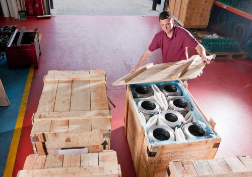 medium-shot-of-a-worker-packing-steel-roller-beari-2026-01-11-09-38-01-utc